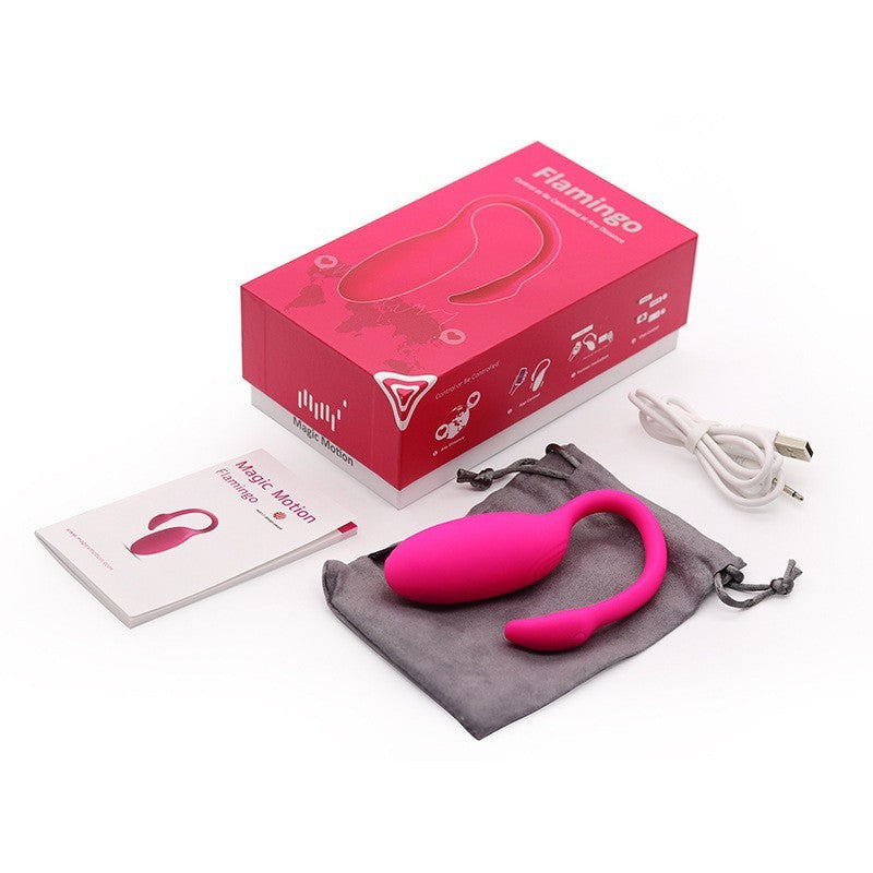 Unboxing of the Flamingo sex toy, featuring a hot pink wearable vibrator displayed alongside its packaging, charging cable, and storage pouch. The box highlights key features like wireless control and waterproof design, ideal for discreet and versatile use.
