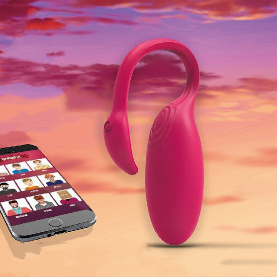 A vibrant pink smart vibrator with a flexible curved design for targeted stimulation, paired with a smartphone displaying a diverse dating app interface, set against a sunset background. This innovative sex toy offers remote control via the app for customizable pleasure experiences