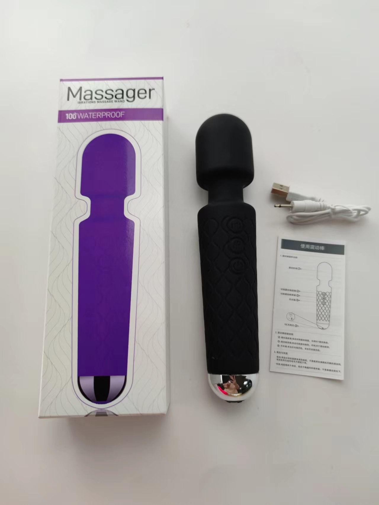 Unveil the thrill with this dark and mysterious black vibrator, displayed alongside its packaging and a USB charging cable. The box promises 100% waterproof pleasure, ensuring that this enticing toy is ready for some steamy adventures. The design is detailed with a textured grip for enhanced handling, making every touch intensely satisfying.