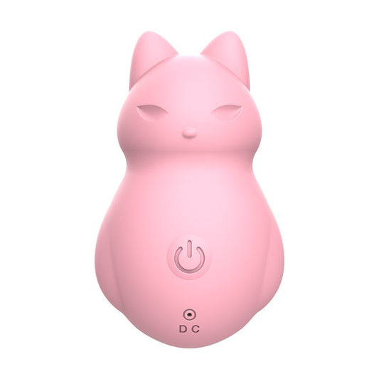 Soft pink, cat-shaped massager with minimalist facial features and a gentle expression. This adorable device features a single button for operation and a DC charging port, combining whimsical design with practical functionality. The smooth, rounded body is crafted from body-safe silicone, ideal for providing soothing vibrations in a charming and discreet form.